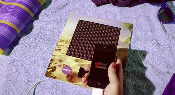 Interactive print ad by Nivea with solar-powered smartphone charger on back page of magazine.
