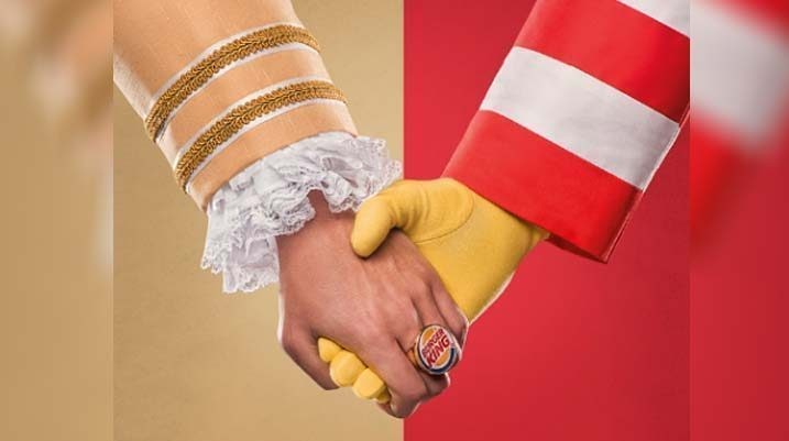 The Burger King King and Ronald McDonald hold hands in solidarity for the Day Without a Big Mac Campaign