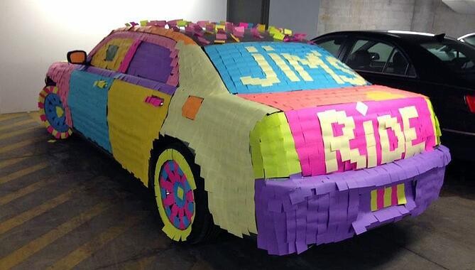 Office prank with sticky notes covering coworker's car