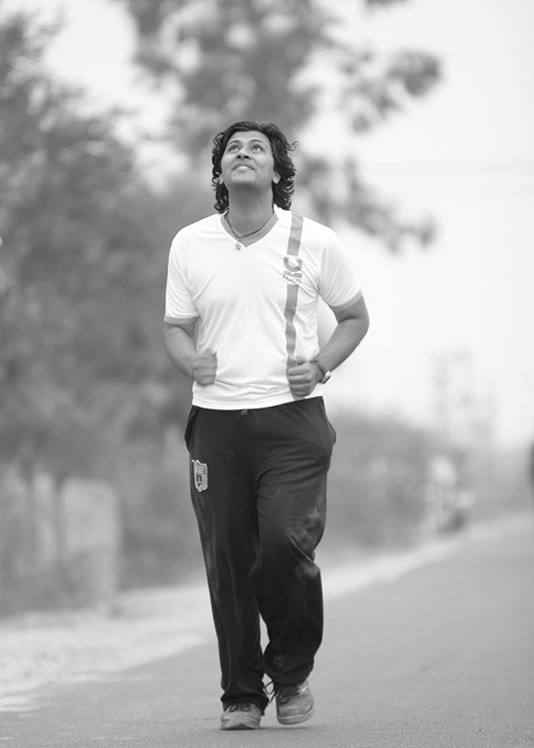 Raghavendra training for a marathon in 2013.