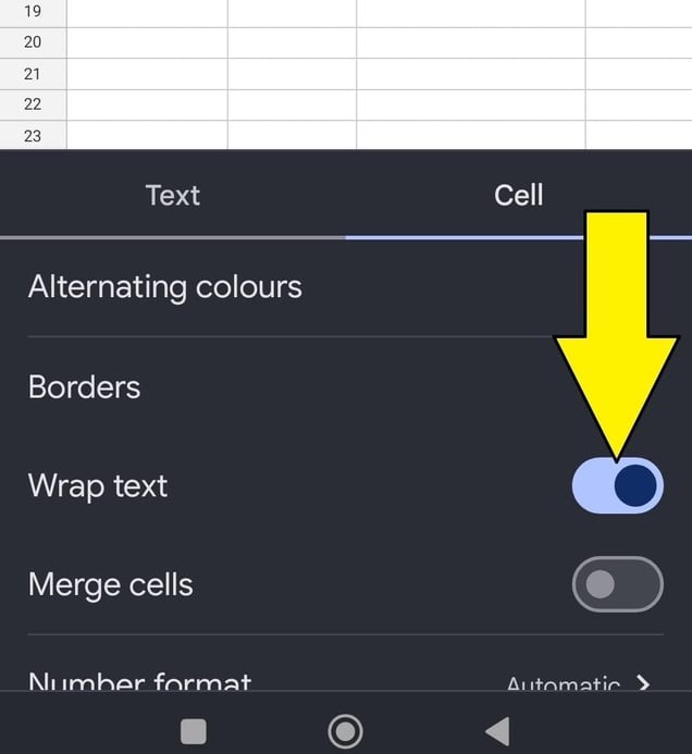 how to wrap text in Google Sheets on mobile, an arrow pointing to the wrap text toggle which is on. 