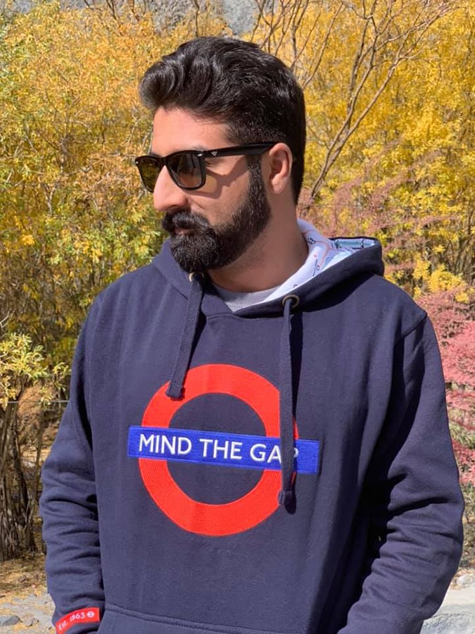 Ihtisham Zahoor wearing a sweatshirt with the London tube sign 'Mind the Gap'.