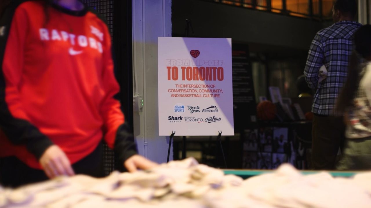 A table with Professional women's basketball in Toronto t-shirts.